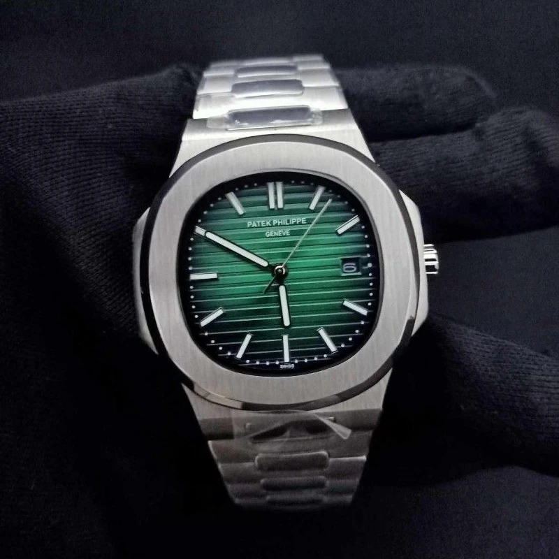 Patek-Philippes-Nautilus-green-on-hand.webp